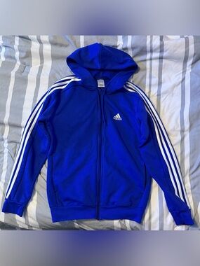 Blue Adidas hoodie.